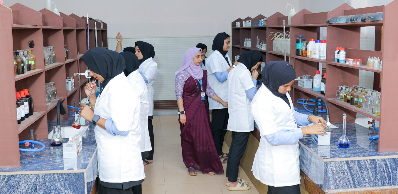 Students conducting chemistry experiments in a college lab.
