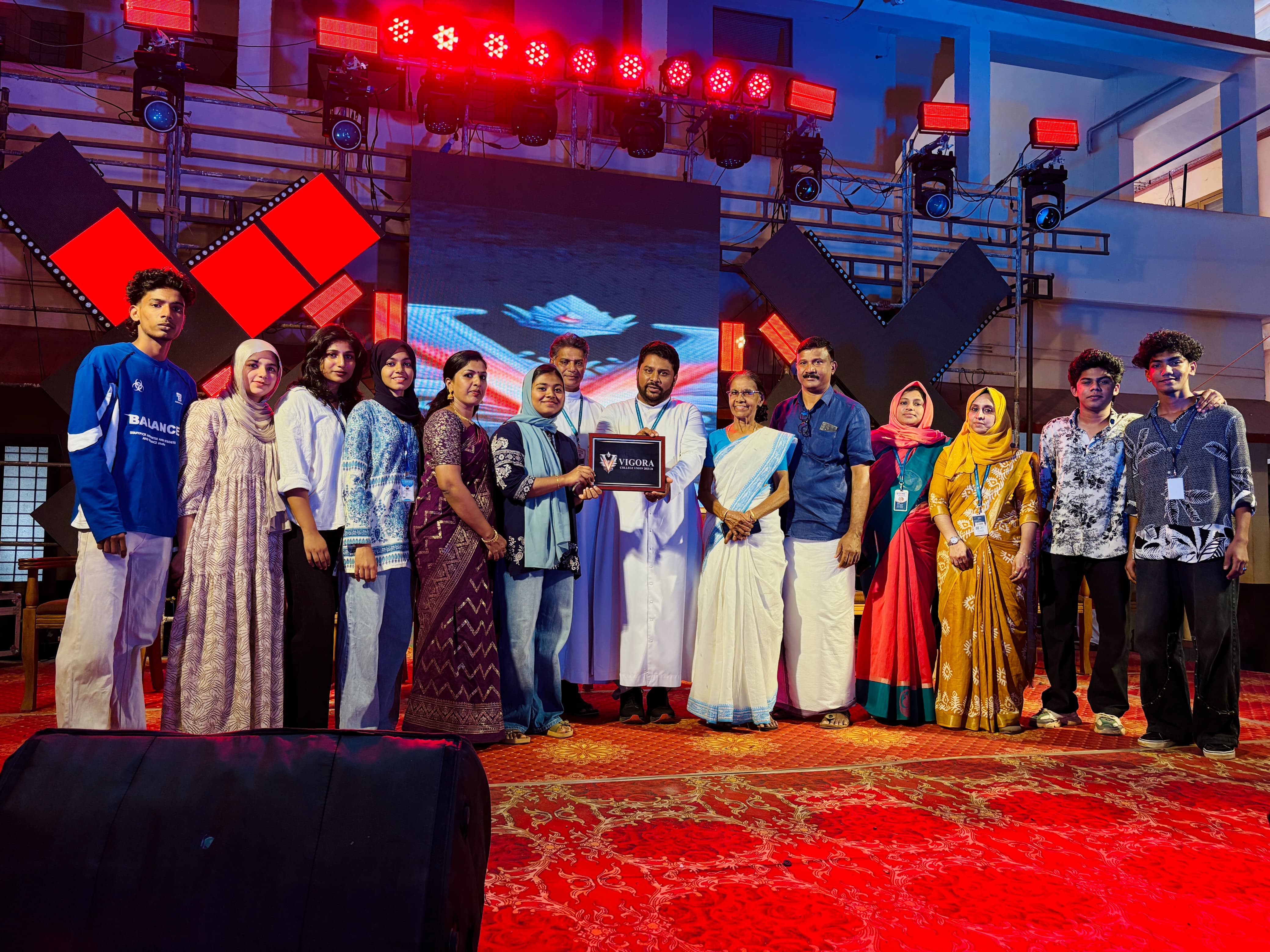 Women students in lab coats performing chemistry experiments with glassware in a college laboratory